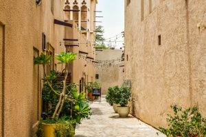 An alleyway with potted plants in the Al Fahidi District of Dubai